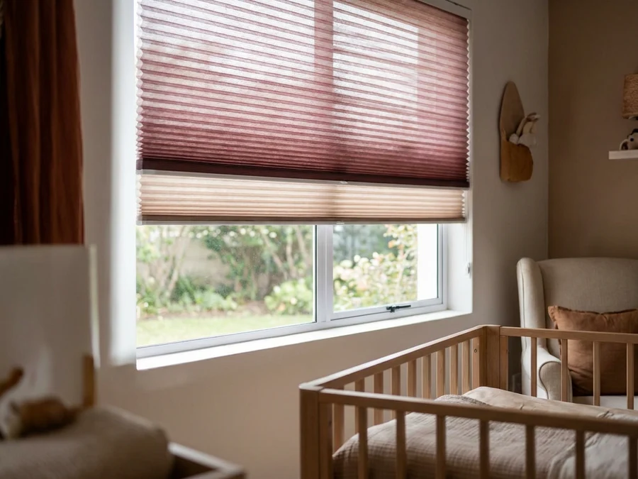 Cellular honeycomb blind lowered over a nursery window in a Brackenfell home
